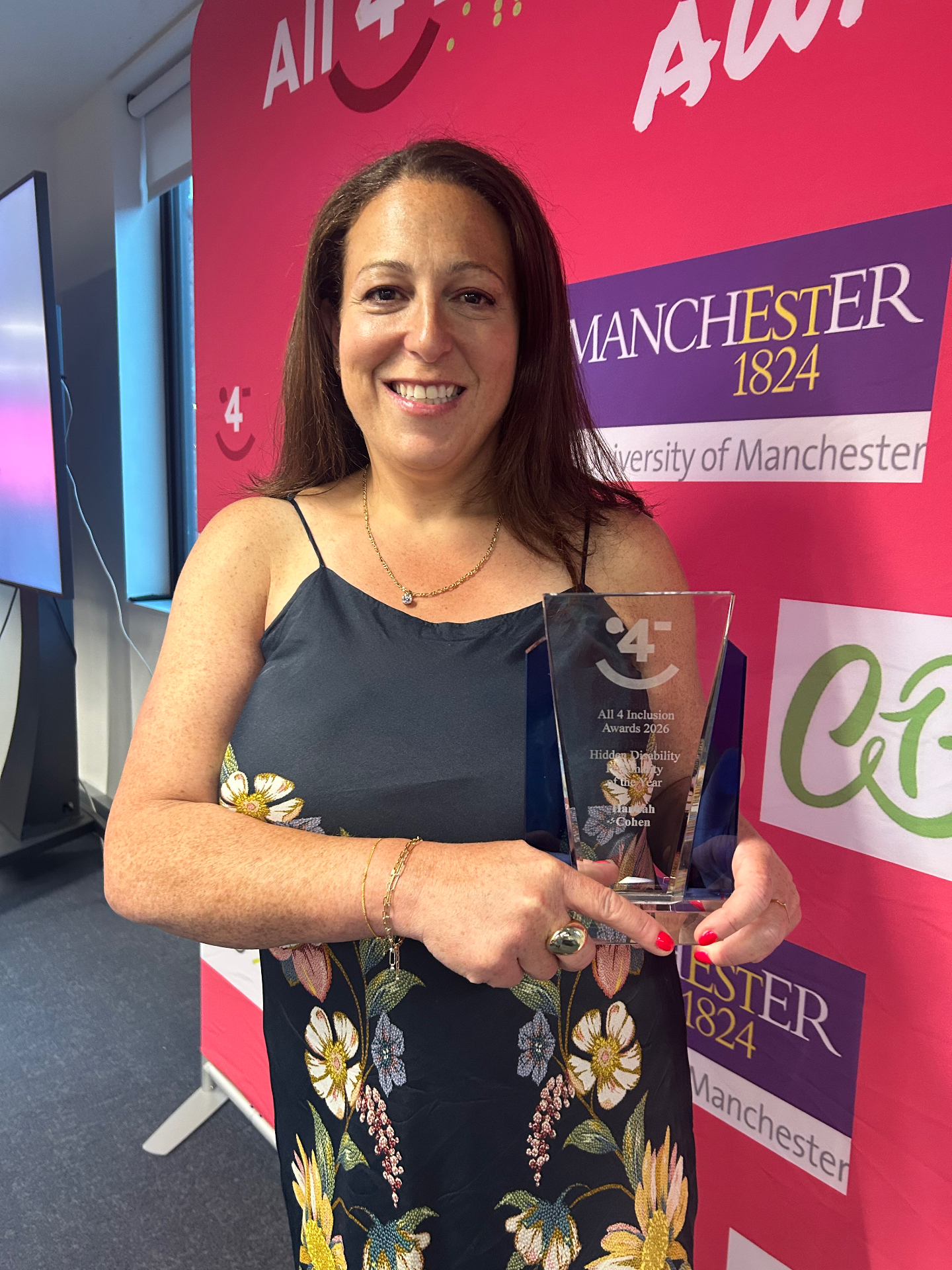 Hannah Cohen holding the 2026 Hidden Disability Personality of the Year trophy